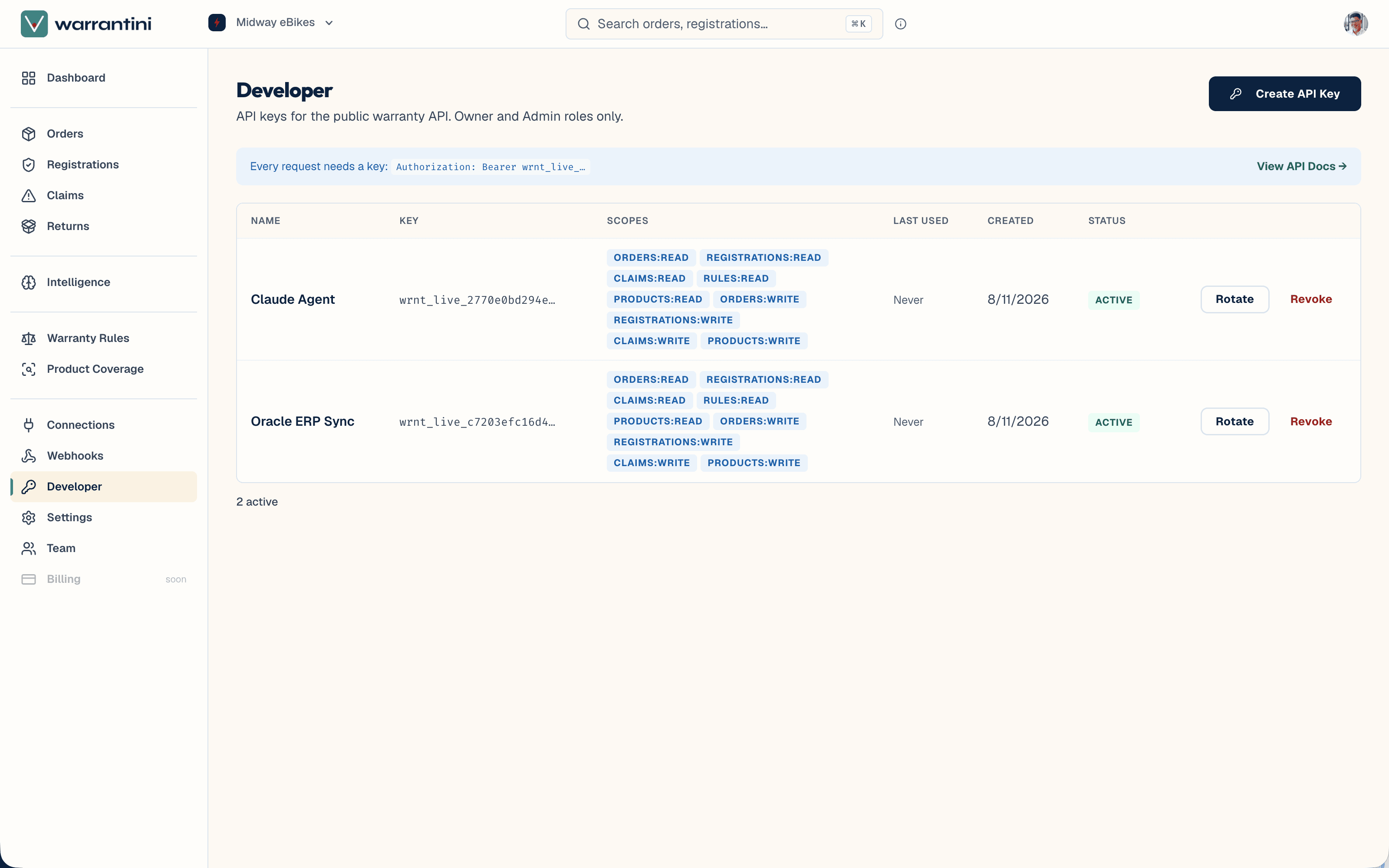 The developer API keys page in the merchant dashboard: a table of keys with their scopes, creation date, and active status, each rotatable or revocable, above a Create API Key action.